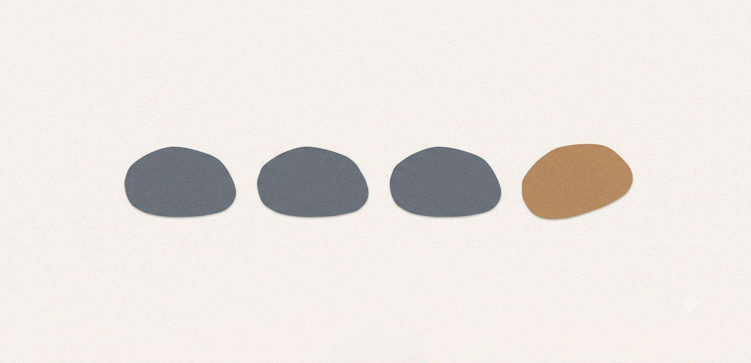 Three carefully aligned stones setting a pattern and a fourth echoing their shape and spacing; one clay stone sets the standard.